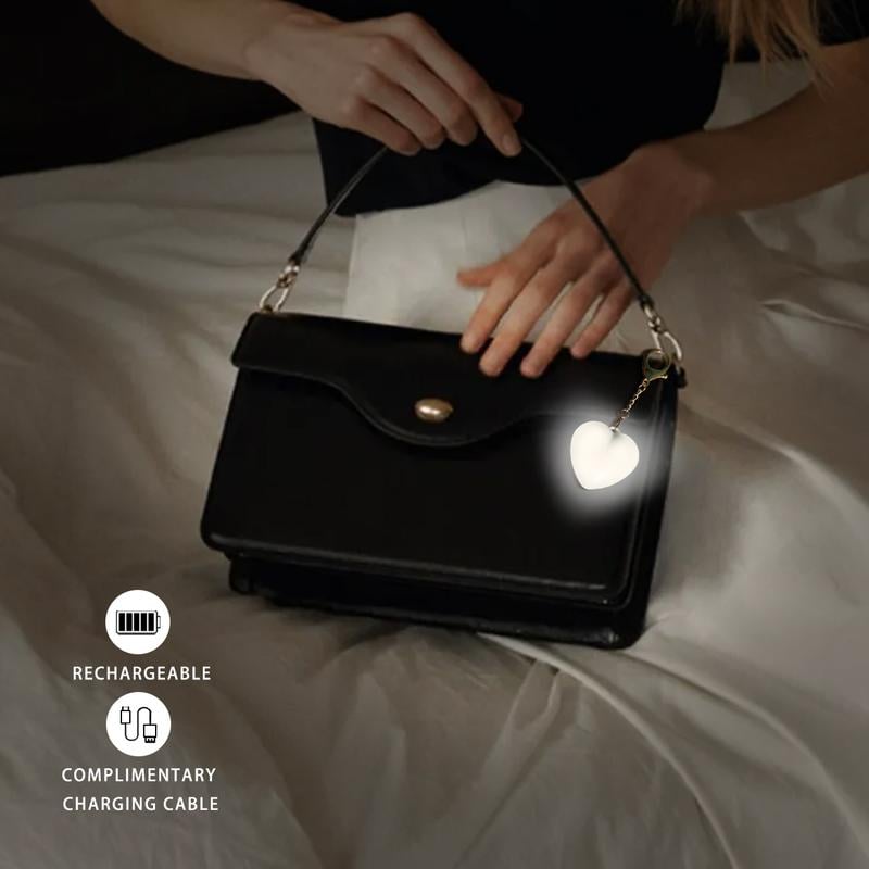 Arenzza LED Touch Sensor Bag Light glowing white, compact electronic accessory with touch activation for easy use.