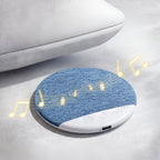 Arenzza pillow speaker for sleeping, compact electronic accessory with soft fabric cover, designed for relaxing audio experience.