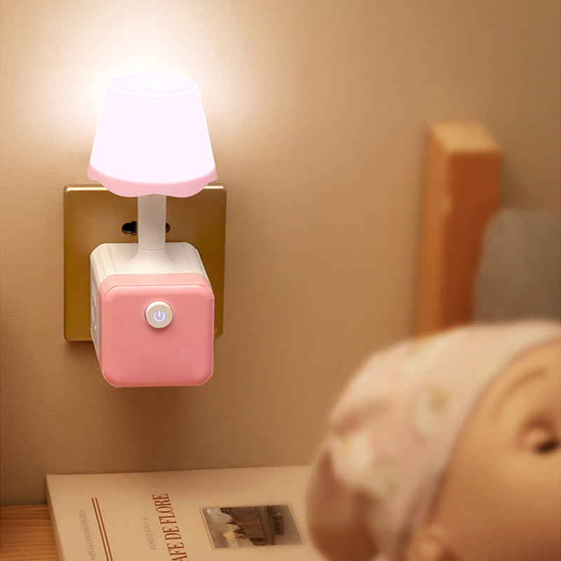 Arenzza 2-in-1 Cube Socket LED Night Lamp plugged into an electrical outlet, providing soft illumination in a modern home setting.