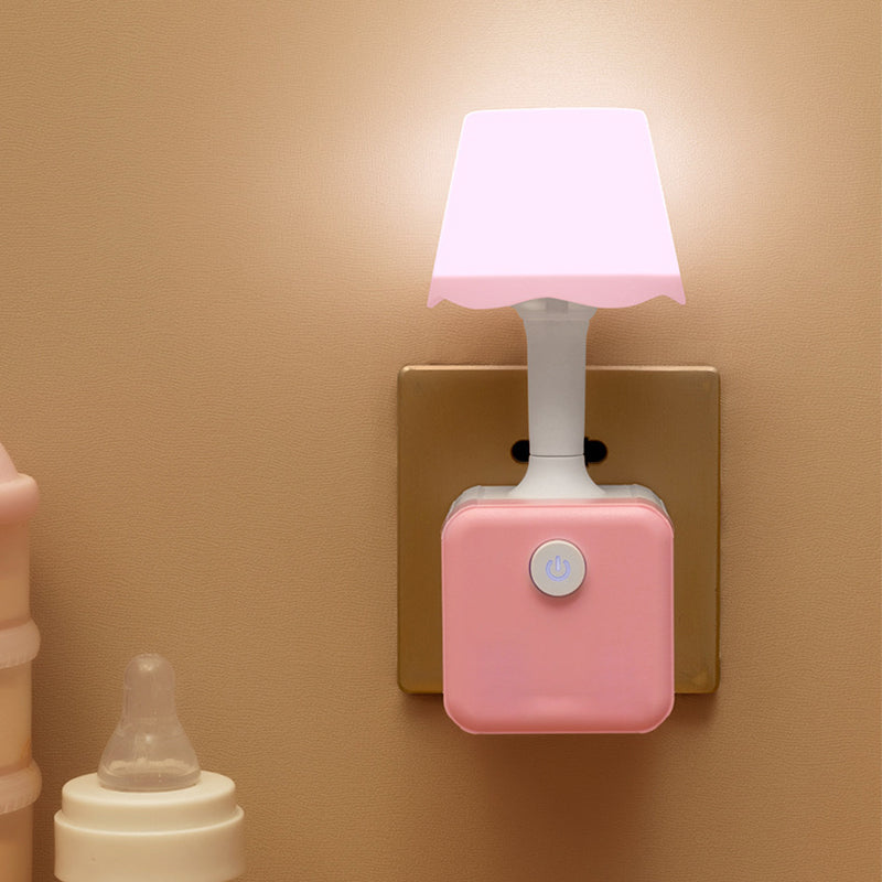 Arenzza 2-in-1 Cube Socket LED Night Lamp plugged into an electrical socket, providing soft, ambient light in a modern home setting.