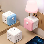 Arenzza 2-in-1 Cube Socket LED Night Lamp connected to a power socket, providing soft illumination for a bedroom or living space.