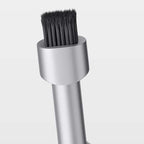 Arenzza 2-in-1 earphone cleaning brush and SIM ejector pin in black, portable multi-tool for electronics and accessories.