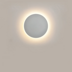 Arenzza modern round LED wall sconce mounted on a wall, showcasing sleek electronic lighting design for home or office decor.