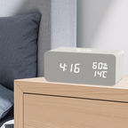Arenzza LED digital alarm clock with wireless charging station, displaying time on a sleek black electronic device