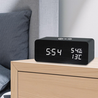 Arenzza LED digital alarm clock with wireless charging station, showing time display and modern electronic design.