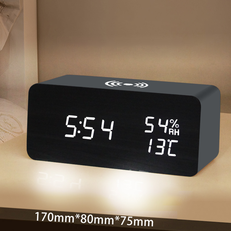 Arenzza LED digital alarm clock with wireless charging station, displaying time on a sleek electronic device.