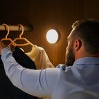 Arenzza energy-efficient LED motion sensor light mounted on a wall, showcasing its sleek design and motion detection feature.