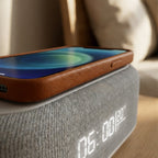 Arenzza 6-in-1 wireless charging station for smartphones, smartwatch, earbuds, and accessories on a sleek black surface.