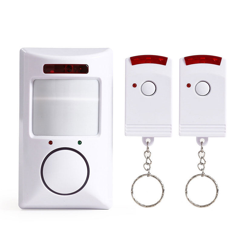 Infrared motion sensor alarm by Arenzza with two remote controls, electronic security device with motion detection feature.