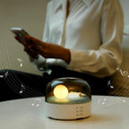 Arenzza Moon Sea Landscape LED night light speaker with a scenic moon and ocean design, compact electronic device with controls visible.