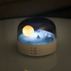 Arenzza Moon Sea Landscape LED night light speaker with a scenic moon and ocean design, showcasing its soft lighting and speaker grille.