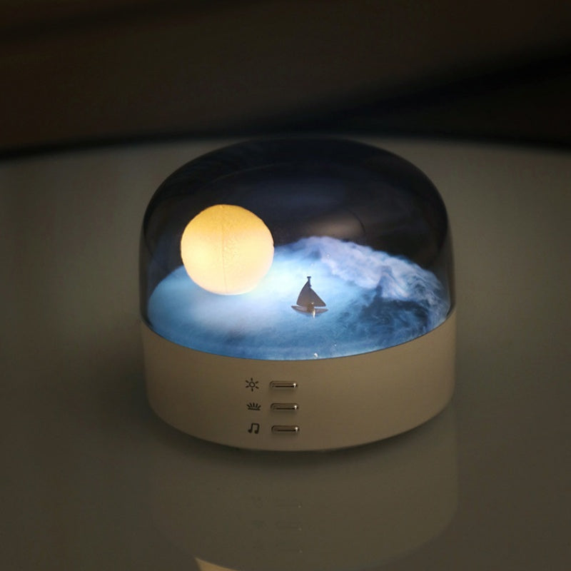 Arenzza Moon Sea Landscape LED night light speaker with a scenic moon and ocean design, showcasing its soft lighting and speaker grille.