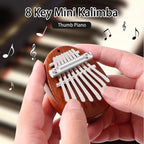 Arenzza Palm Finger Piano toy, small portable music instrument for children, featuring colorful keys and compact design for fun music play.
