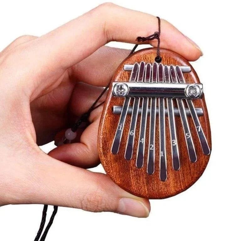 Arenzza Palm Finger Piano toy, compact handheld musical instrument for kids, featuring colorful keys for musical play and entertainment.