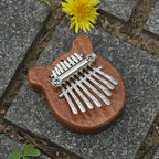 Arenzza Palm Finger Piano toy, compact musical instrument for kids, featuring colorful keys and a fun, portable design.