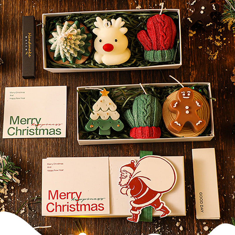 A set of Christmas scented candles from Arenzza, featuring festive holiday packaging and warm, inviting candle flames.