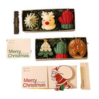 Arenzza Christmas scented candle gift set with festive candles in decorative containers for holiday and Halloween ambiance.