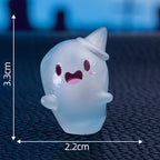 Cute glow-in-the-dark mini ghost figurines for Halloween and Christmas by Arenzza, shown in a festive display.