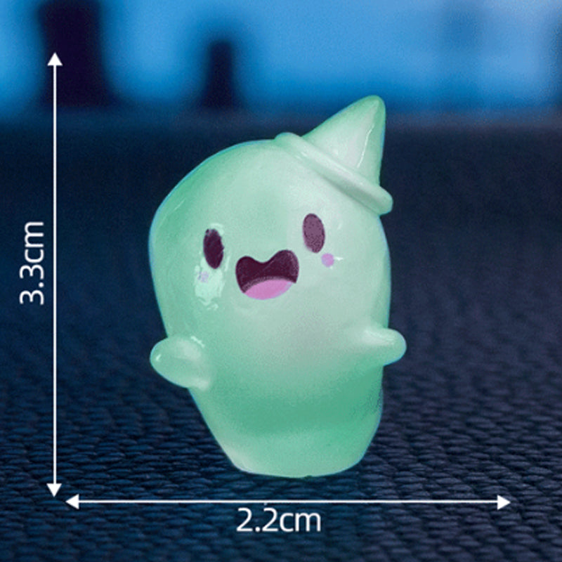 Cute glow-in-the-dark mini ghost figurines for Halloween and Christmas by Arenzza, shown in a festive display.