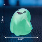 Cute glow-in-the-dark mini ghost figurines for Halloween and Christmas by Arenzza, featuring playful ghost designs in a festive setting.