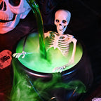 Arenzza Halloween indoor decoration featuring a witches' cauldron with floating potion bottles and fog effects.