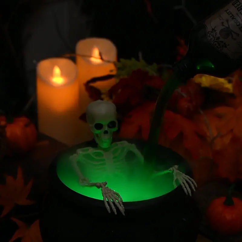 Arenzza Halloween indoor decoration featuring a witches' cauldron with floating potion bottles and fog effects for spooky ambiance.