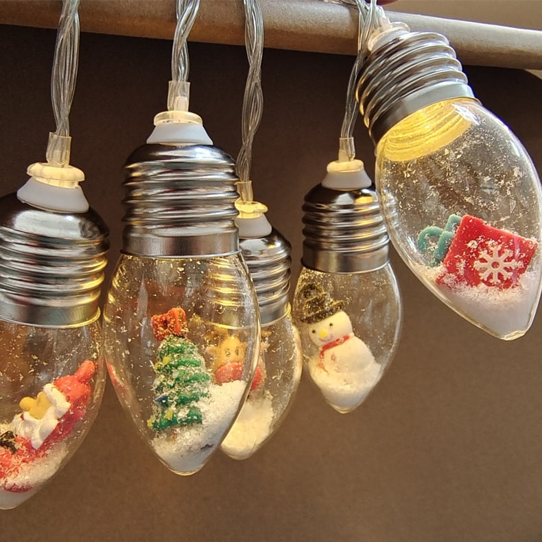 Arenzza Christmas string lights with colorful LED bulbs, suitable for holiday decor, featuring festive Christmas and Halloween themes.