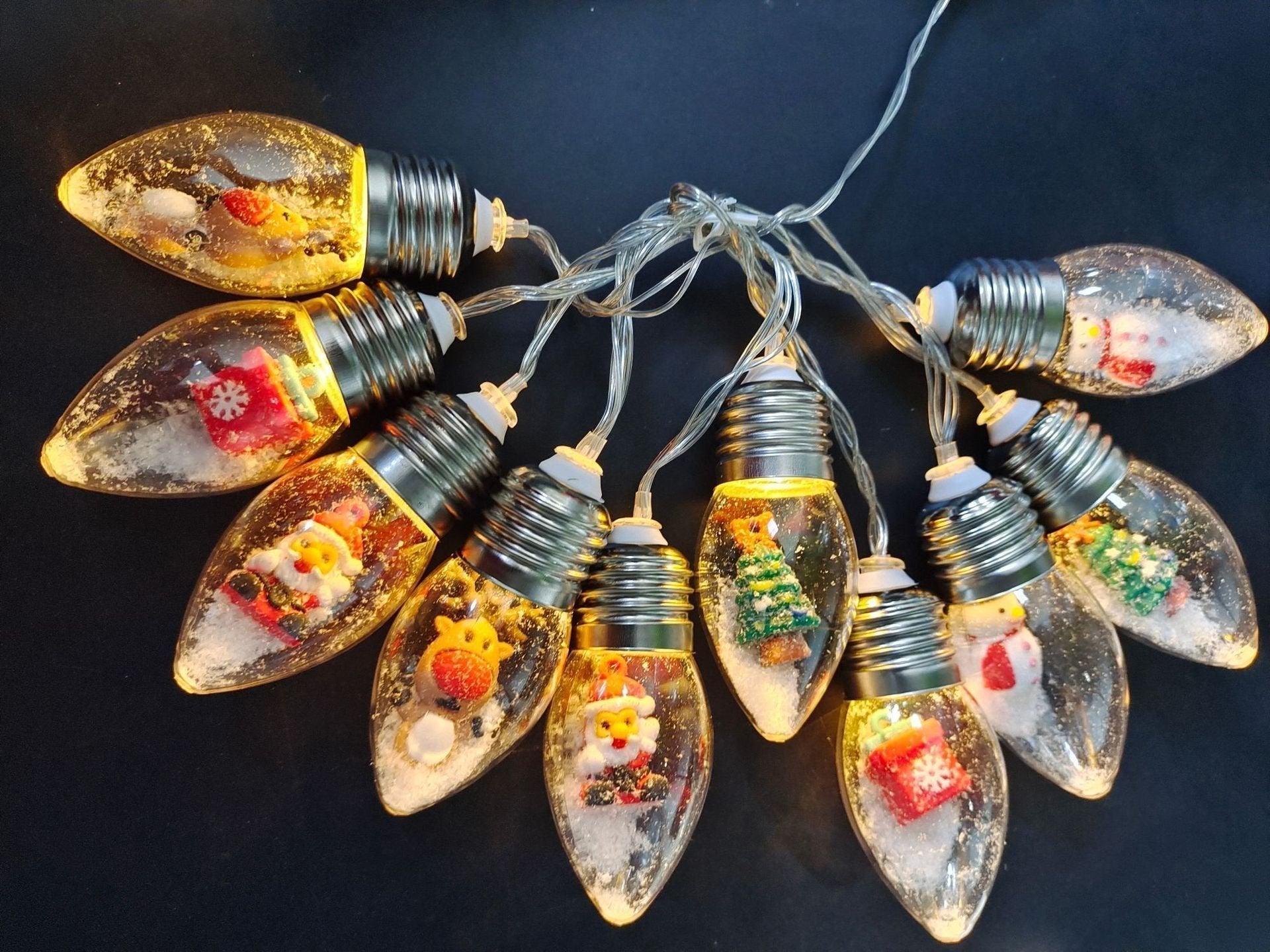 Arenzza Christmas string lights with LED bulbs, perfect for holiday decor, featuring festive holiday-themed lighting on a string.