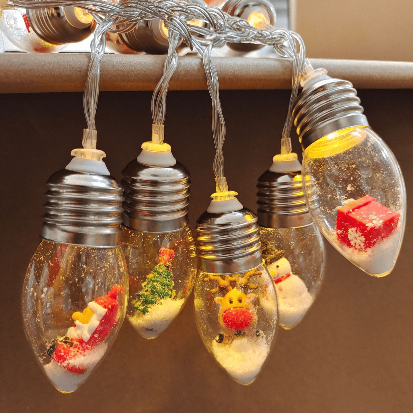 Arenzza Christmas string lights with colorful LED bulbs, perfect for holiday decorating and festive indoor or outdoor displays.