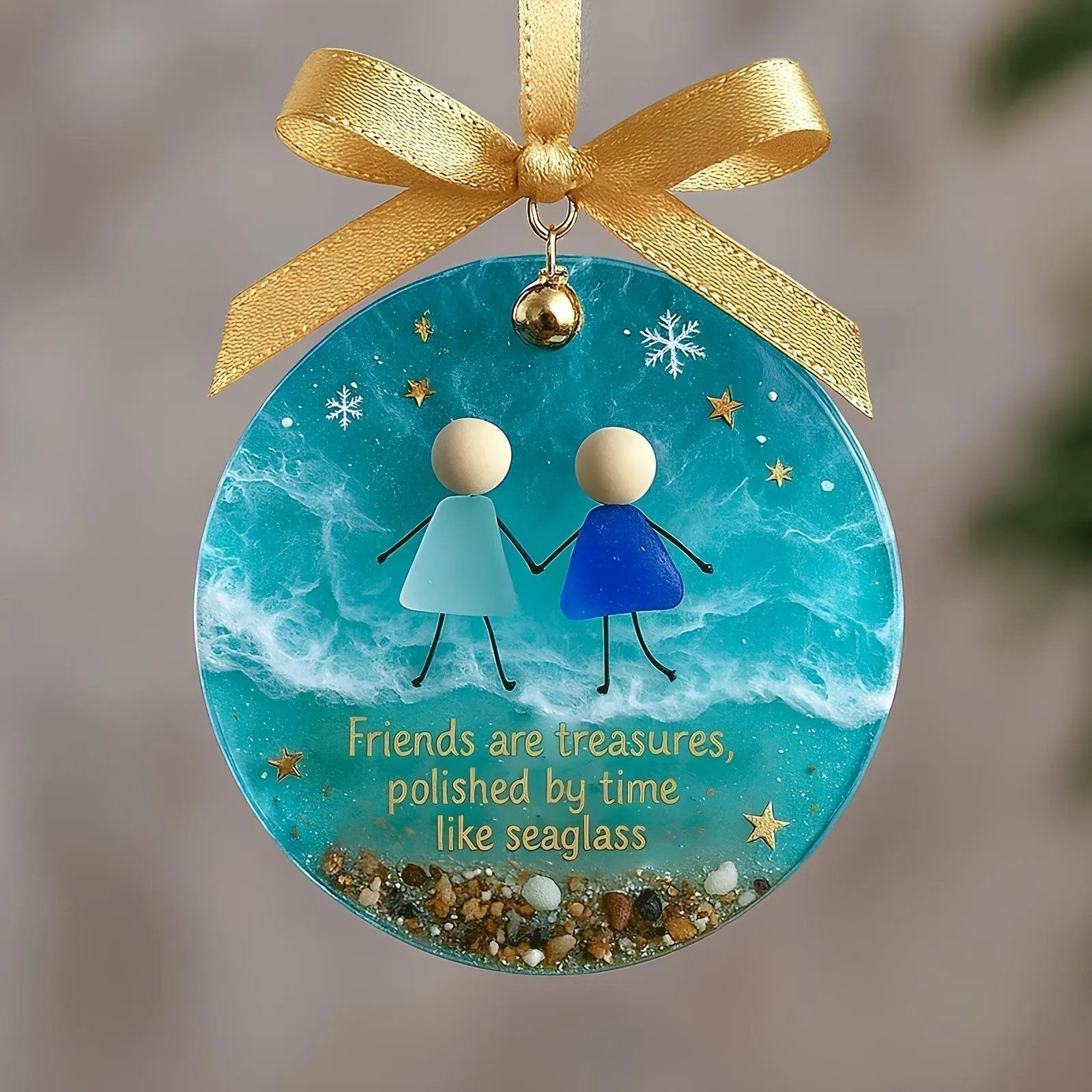A hand-crafted friendship sea glass Christmas ornament with ocean-inspired shapes and shimmering details, designed for holiday decor.