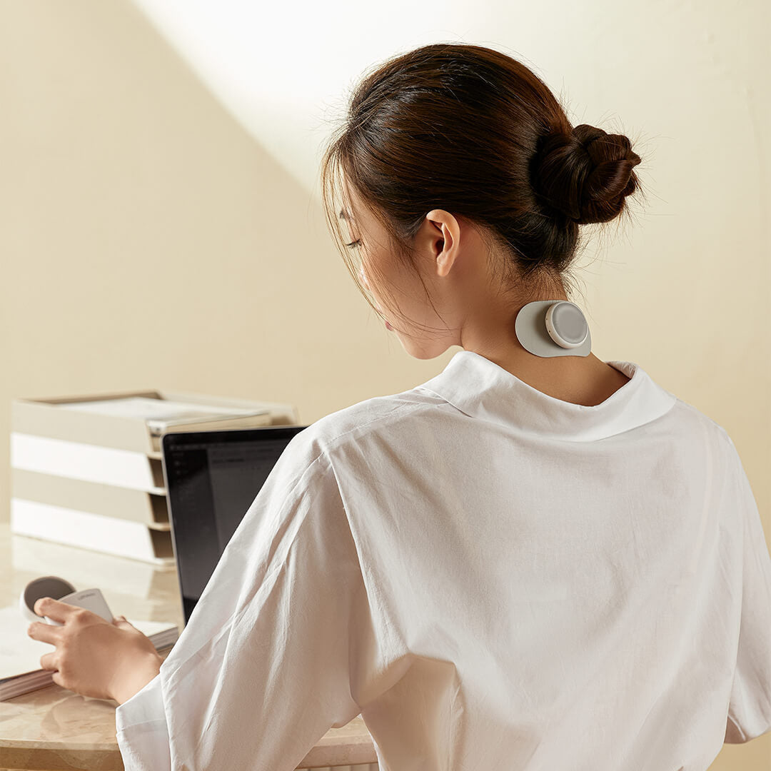 Arenzza Intelligent Massage Pad for health and beauty, showing the padded device with control buttons and ergonomic design.