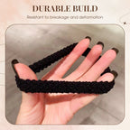 A durable wide elastic hair tie from Arenzza, shown stretched around thick hair for a secure and comfortable hold.
