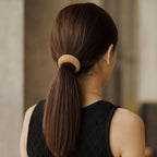 A durable wide elastic hair tie from Arenzza, shown in a close-up, highlighting its stretchy, sturdy design for secure hold.