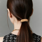 Aarenza durable wide elastic hair tie in black, showing its stretchy, thick elastic band suitable for secure hair styling.