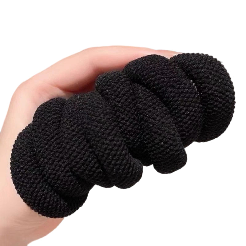 A close-up of a durable wide elastic hair tie from Arenzza, showing its stretchy, thick design ideal for secure hair styling.