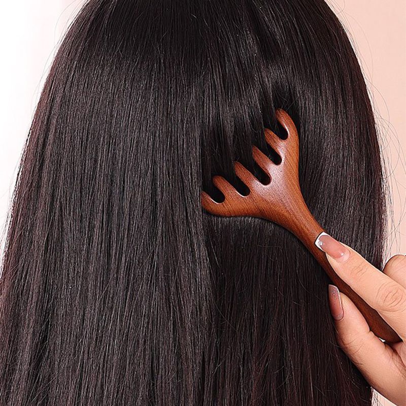 Arenzza Six-claw Meridian Massage Comb in black with six evenly spaced claws, designed for scalp massage and hair care.
