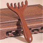 Arenzza six-claw Meridian massage comb in black, designed for scalp relaxation and hair care, shown on a white background.