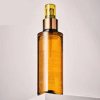 Arenzza hydrating self-tanning mist for a natural glow, displayed in a sleek spray bottle with a clear label.