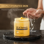 Arenzza turmeric and vitamin C exfoliating body scrub in a clear jar with a white lid, showing the textured scrub inside.