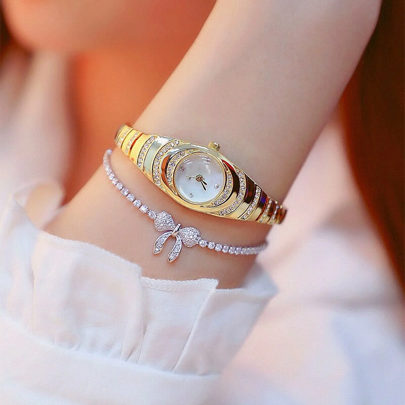 Aarenza women's rhinestone bracelet watch with sparkling stones and a sleek silver band, stylish and elegant for health and beauty.