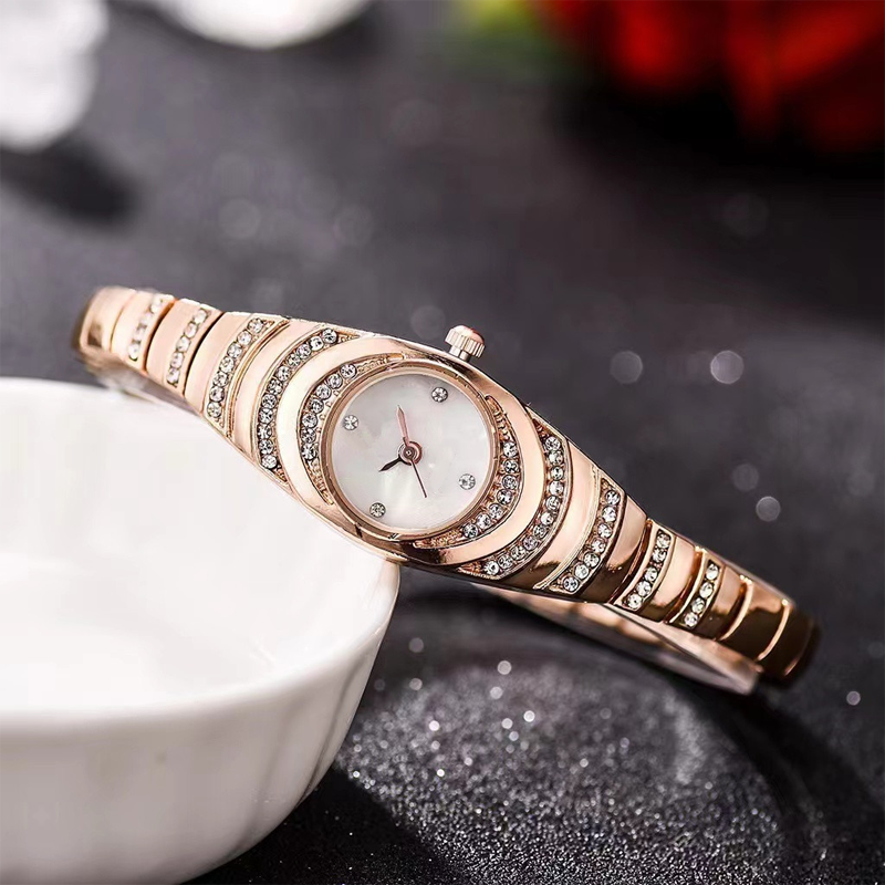Aarenza women's rhinestone bracelet watch with a sleek silver band and sparkling rhinestones on the face, elegant and stylish accessory.