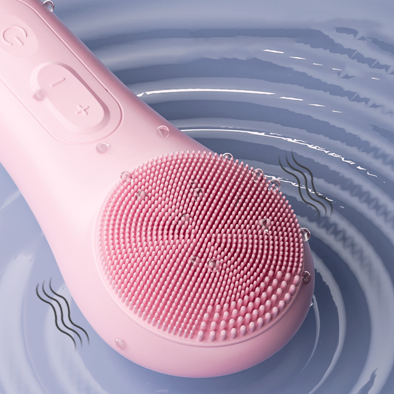 Arenzza electric face scrubber with heat and vibration features, shown with soft silicone bristles and ergonomic handle for skincare.