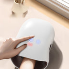 Arenzza 3-speed cordless hand massager with heat and compression, showing a compact device with control buttons and ergonomic design.