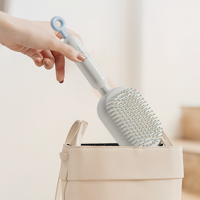 Arenzza portable air cushion hair brush with a sleek handle and soft bristles for gentle hair styling and detangling.