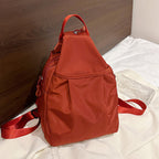 Arenzza lightweight sling bag backpack in black, featuring a sleek design with adjustable strap and multiple compartments.