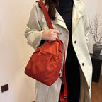 Arenzza lightweight sling bag backpack with adjustable strap, compact design, and multiple compartments for everyday use.