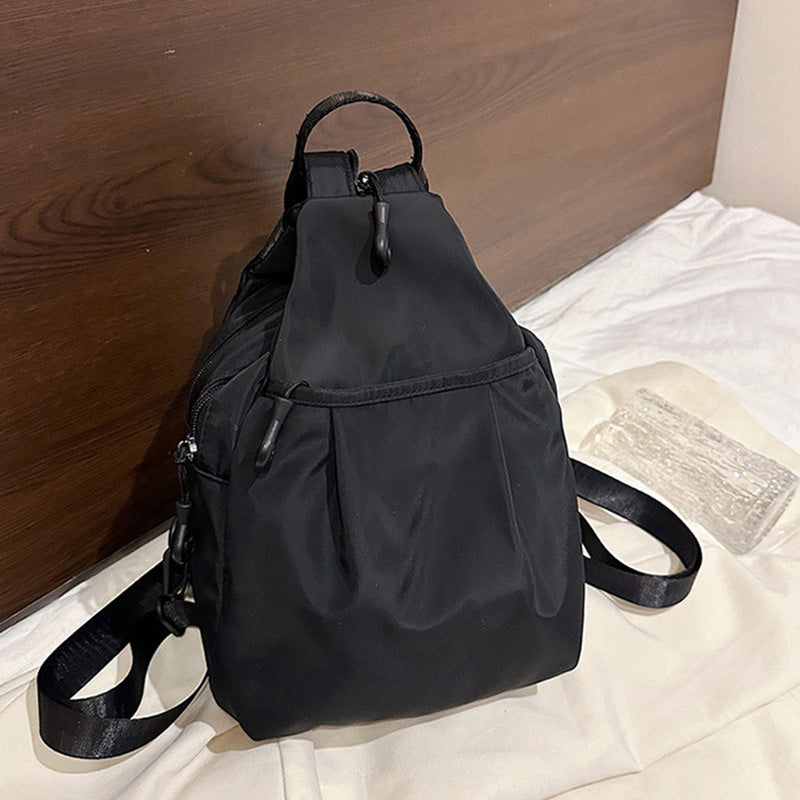 Arenzza lightweight sling bag backpack with multiple compartments, black fabric, and adjustable strap for casual daily use.