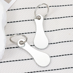 Two stainless steel shopping trolley token keyrings by Arenzza, featuring a sleek design for easy coin replacement and key organization.