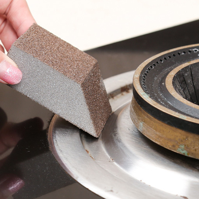 Arenzza Emery Cleaning Sponge for stubborn stains, shown in use on kitchen surface, ideal for household cleaning tasks.