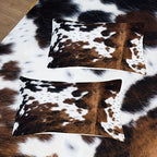 Aarenza cow print duvet cover set with soft, lightweight fabric featuring a fun black and white cow pattern on a bed.